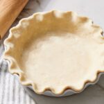 raw pie crust in dish